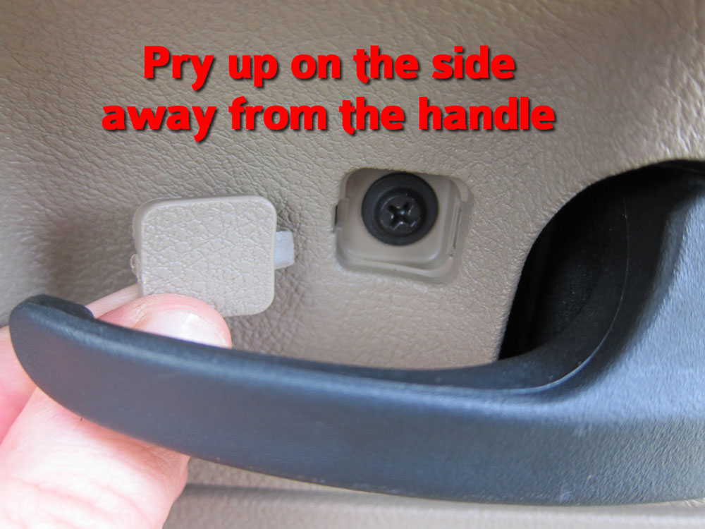 Pry up the screw cover from the right-hand side then remove the screw.
